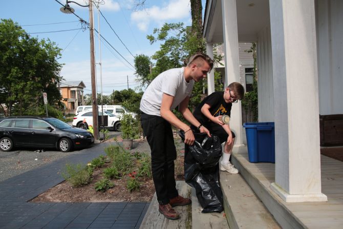 Tristan “Pan” Berlanga and David Krohn picking up glass recycling in Houston’s Old Sixth Ward.